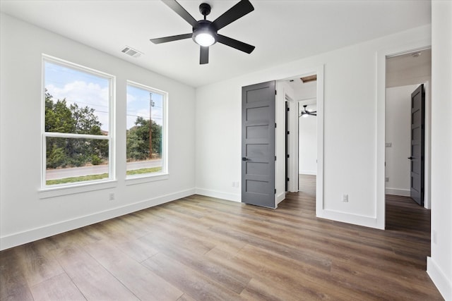 unfurnished bedroom with wood-type flooring and ceiling fan