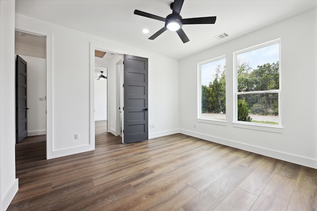 unfurnished bedroom featuring hardwood / wood-style flooring and ceiling fan