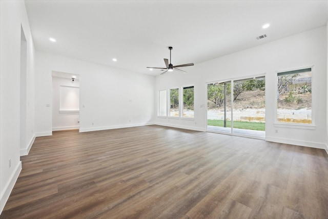 unfurnished living room featuring dark hardwood / wood-style floors and ceiling fan