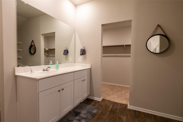 bathroom with wood-type flooring and vanity