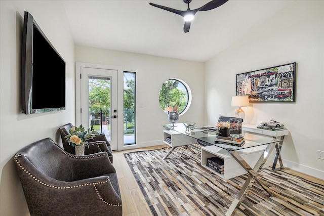 home office with wood-type flooring, vaulted ceiling, and ceiling fan