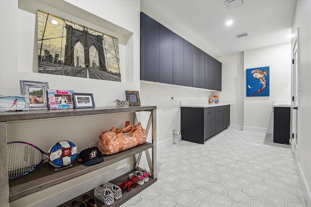 washroom featuring light carpet