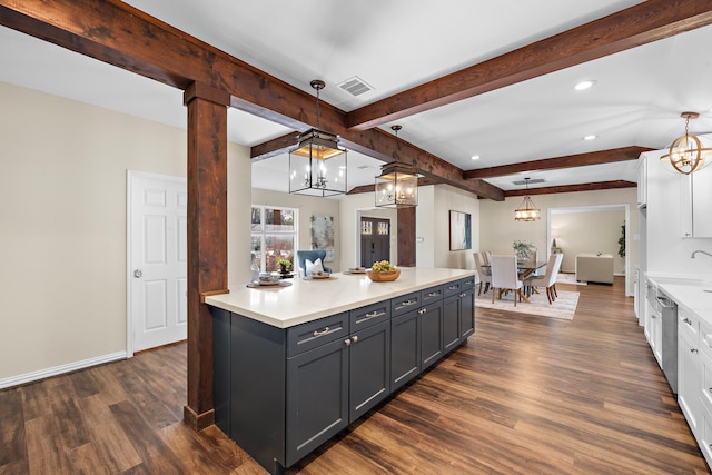 kitchen with white cabinetry, decorative light fixtures, dark hardwood / wood-style floors, and an inviting chandelier