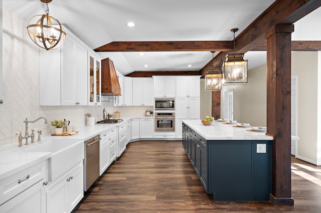 kitchen featuring white cabinetry, appliances with stainless steel finishes, decorative light fixtures, and decorative backsplash