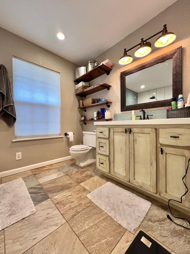 bathroom with vanity and toilet