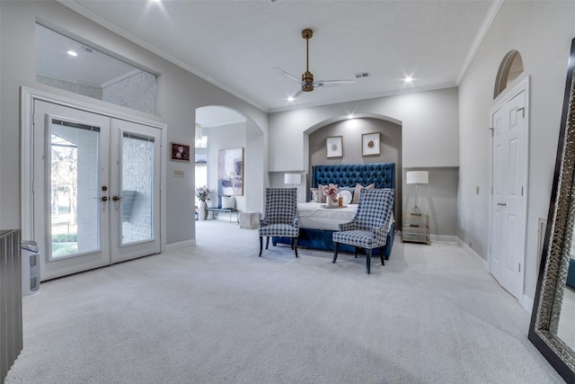 carpeted bedroom with access to exterior, ornamental molding, french doors, and ceiling fan