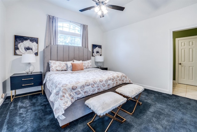 carpeted bedroom featuring lofted ceiling and ceiling fan