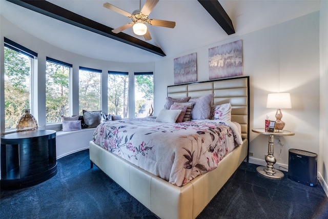 carpeted bedroom with multiple windows, vaulted ceiling with beams, and ceiling fan