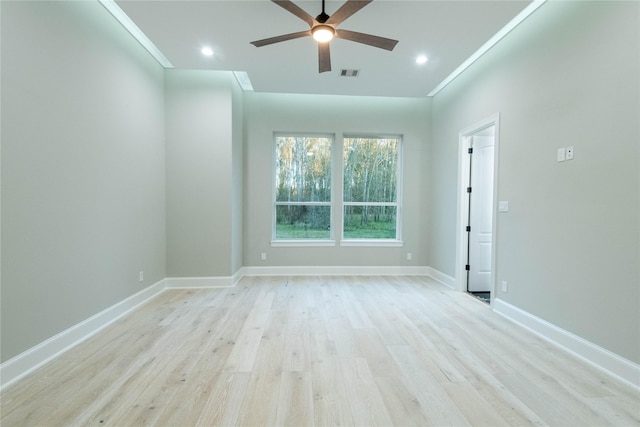 empty room featuring ceiling fan, ornamental molding, and light hardwood / wood-style floors