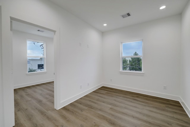 unfurnished room featuring hardwood / wood-style flooring