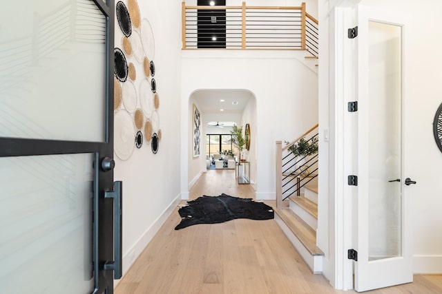 foyer entrance with light hardwood / wood-style flooring