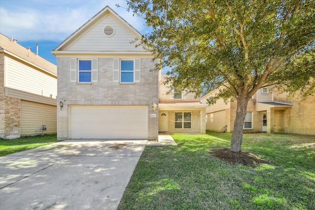 view of front of home featuring a garage and a front yard