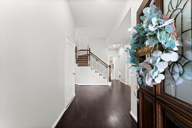 entryway with hardwood / wood-style flooring