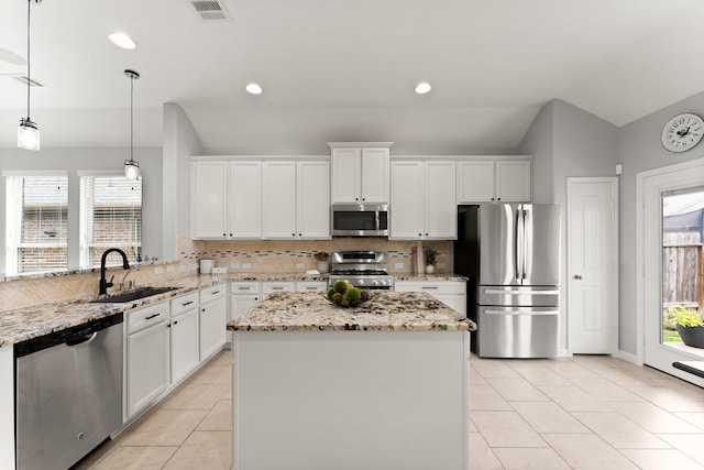 kitchen with white cabinetry, sink, and stainless steel appliances