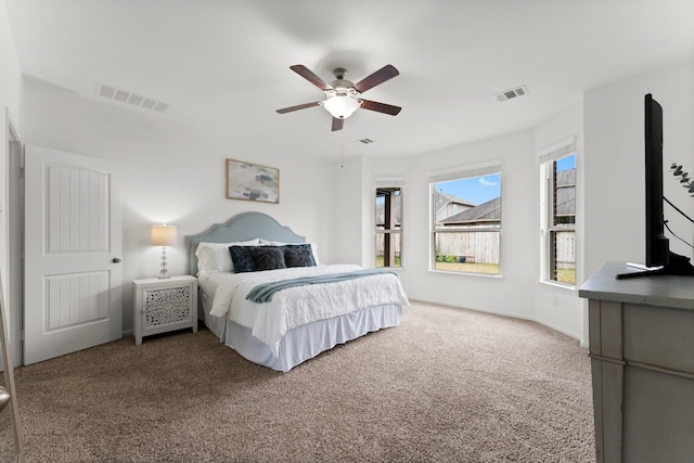 carpeted bedroom with ceiling fan