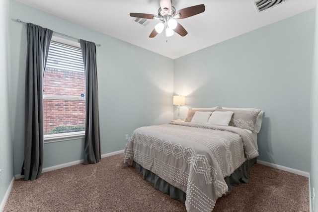 bedroom featuring multiple windows, carpet floors, and ceiling fan