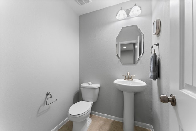 bathroom with sink and toilet