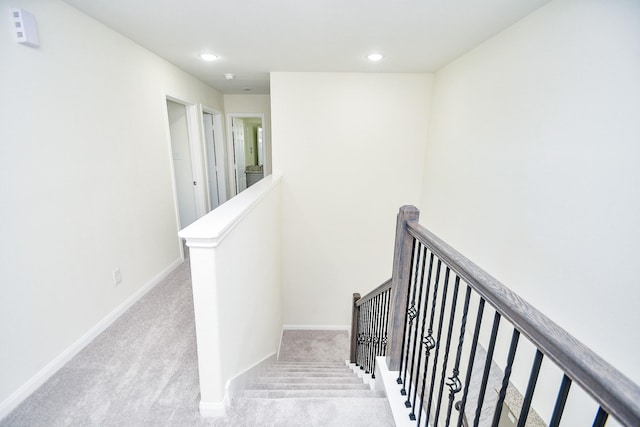 stairway with carpet floors