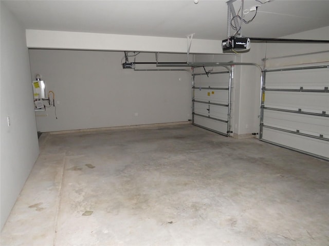 garage with a garage door opener and water heater