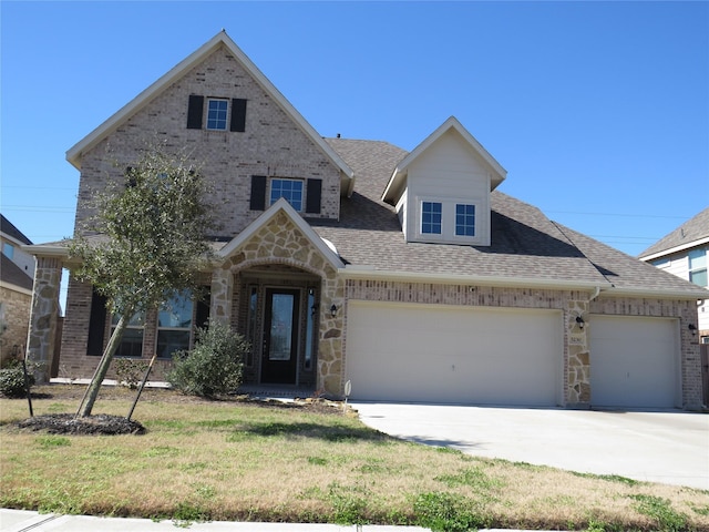 view of front facade with a garage and a front yard