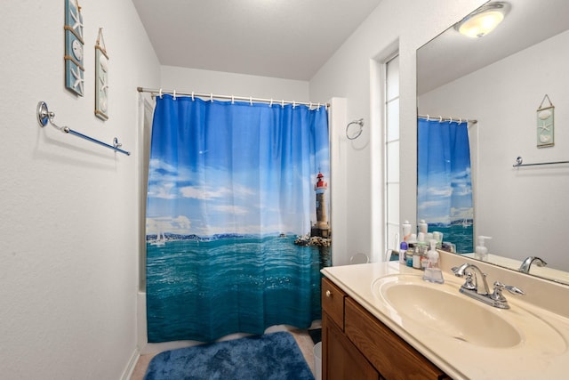 bathroom with vanity and curtained shower