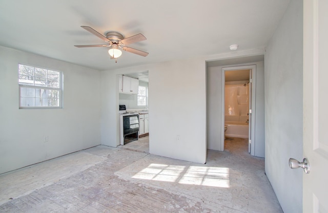 interior space with ceiling fan