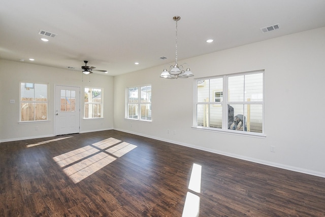 interior space with dark hardwood / wood-style flooring and ceiling fan with notable chandelier