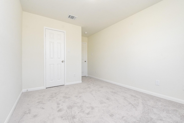 unfurnished bedroom featuring light colored carpet