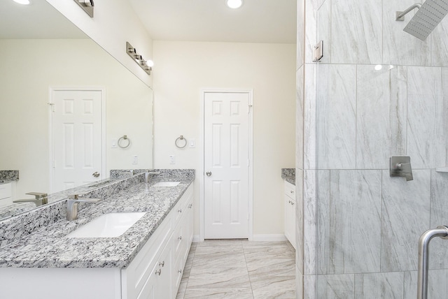 bathroom with vanity and a shower with door