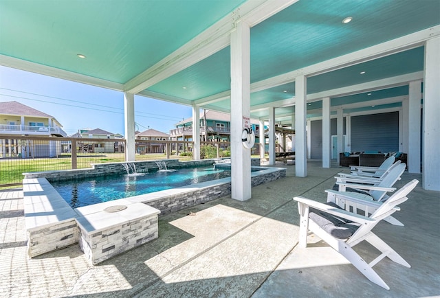 view of swimming pool featuring pool water feature and a patio area