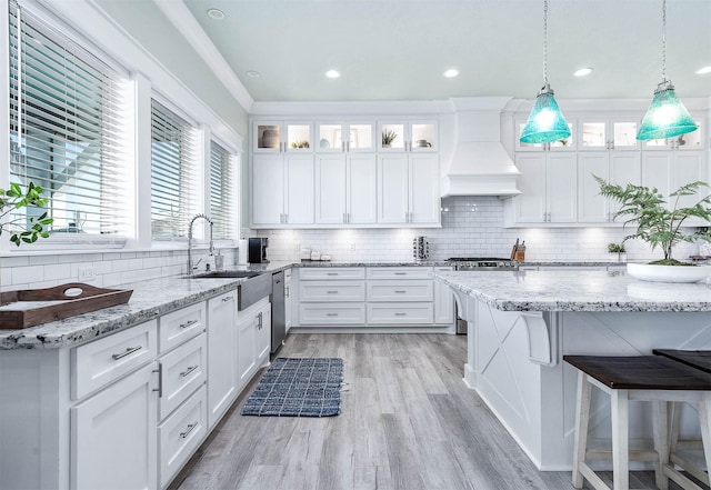 kitchen featuring custom exhaust hood and white cabinets