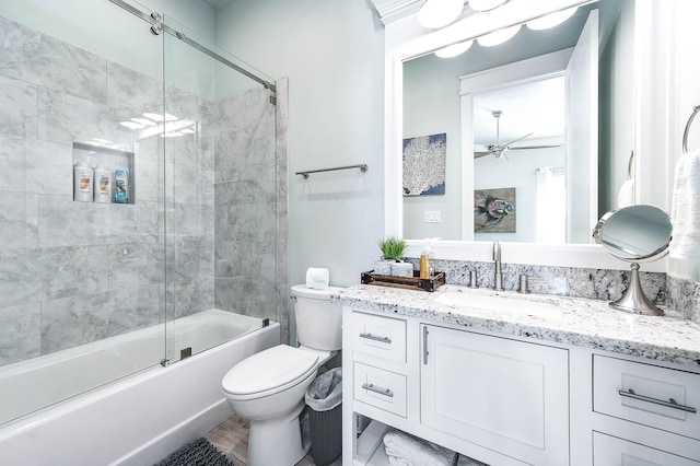 full bathroom with ceiling fan, enclosed tub / shower combo, vanity, and toilet