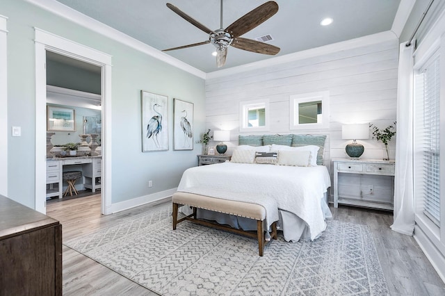 bedroom featuring ornamental molding, ceiling fan, and light hardwood / wood-style flooring