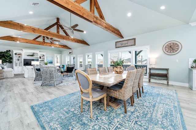 dining room with ceiling fan, high vaulted ceiling, light hardwood / wood-style floors, and beamed ceiling