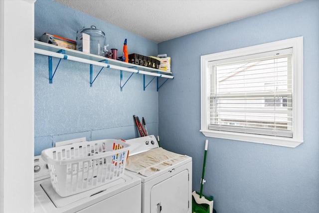 washroom featuring washing machine and clothes dryer