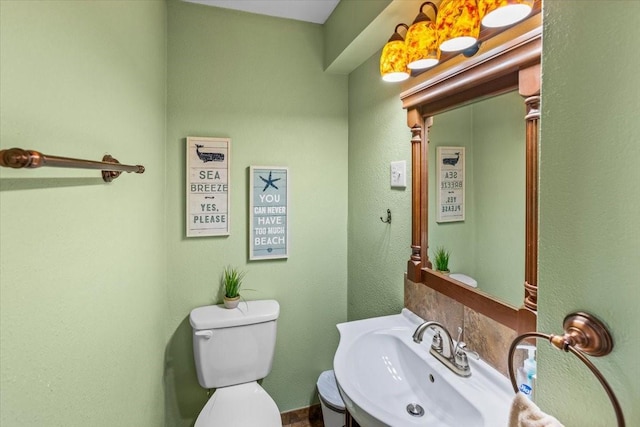 bathroom featuring sink and toilet