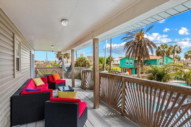 deck featuring outdoor lounge area