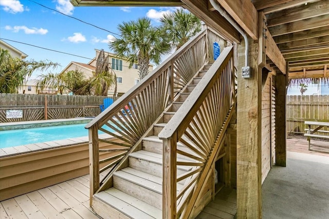 exterior space featuring a fenced in pool