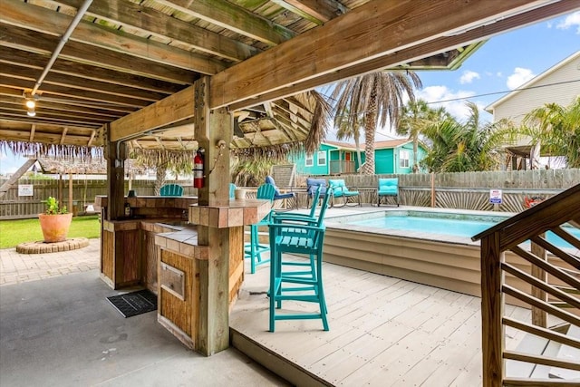 view of patio / terrace featuring an outdoor bar