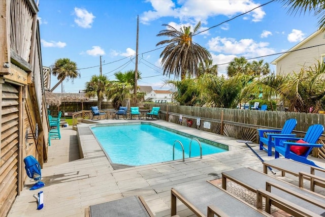 view of swimming pool with a wooden deck