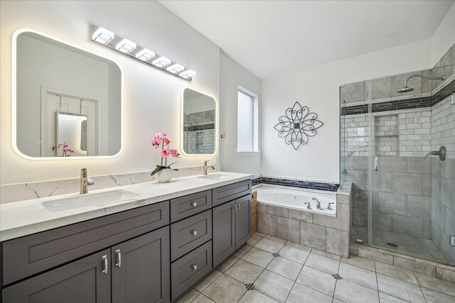 bathroom with vanity, tile patterned flooring, and independent shower and bath