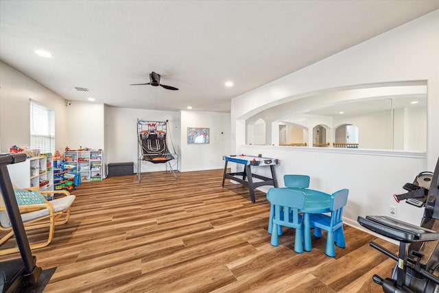 recreation room featuring light hardwood / wood-style flooring and ceiling fan