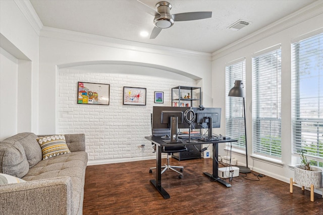 office featuring crown molding, brick wall, dark wood-type flooring, and ceiling fan