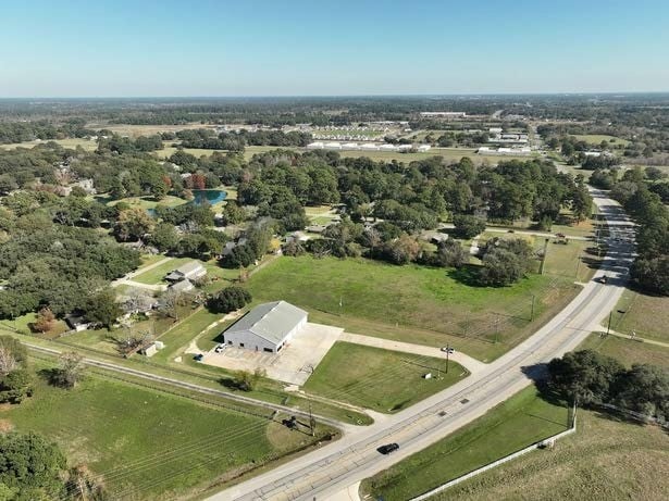 birds eye view of property with a rural view