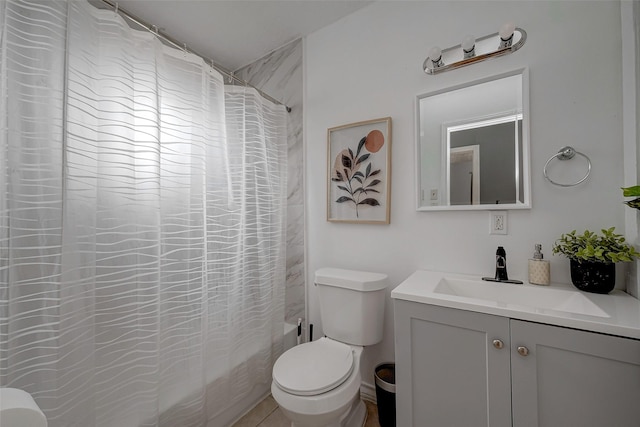 full bathroom with vanity, shower / tub combo with curtain, and toilet