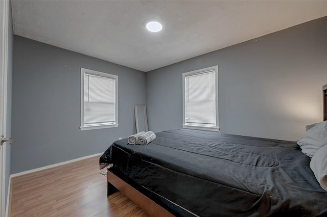 bedroom with wood-type flooring