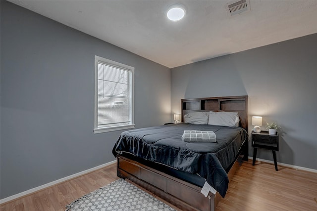 bedroom with light hardwood / wood-style floors