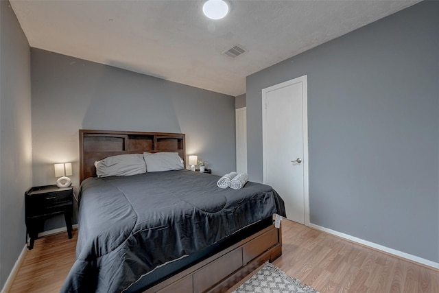 bedroom with light wood-type flooring