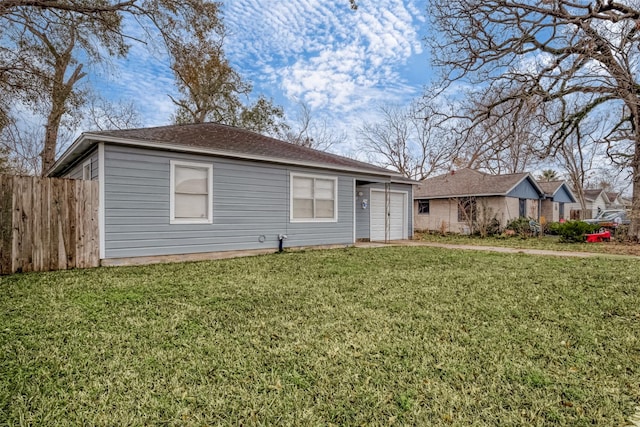 single story home featuring a garage and a front yard