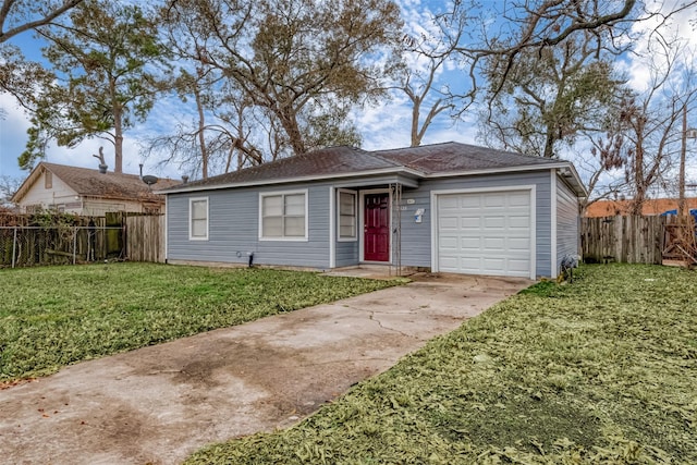 ranch-style house featuring a garage and a front lawn